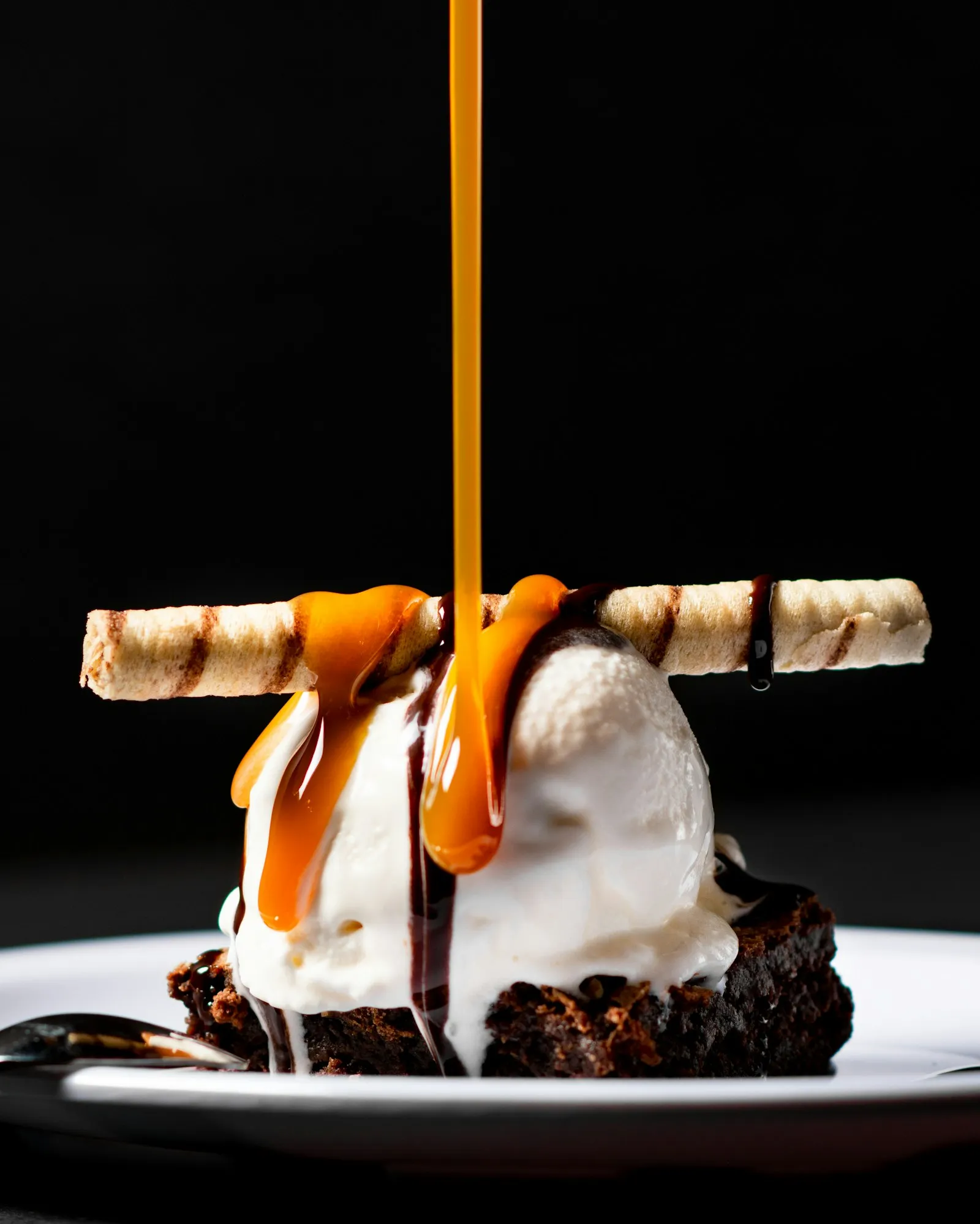 Warm dessert with vanilla ice cream and a caramel pour