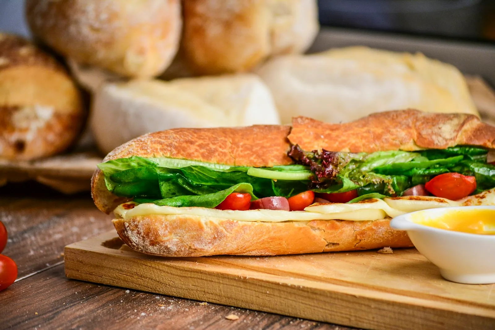 Dressed po'boy on toasted French bread with lettuce and tomato